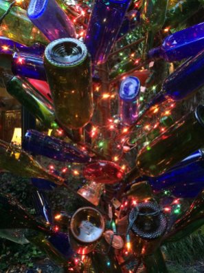 Bottle tree with string lighting at night